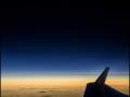 On a jet 45000 ft above the Pacific, the first view to August 2017 total solar eclipse is photographed before the moon shadow reaches the mainland US.